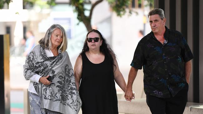 Whiskey Au Go Go fire survivor Donna Phillips (left) and siblings Sonya and Kim Carroll who lost their mother Desmae to the fire, arrive at the Coroner's Court for a two day pre-inquest hearing into the 1973 firebombing of the nightclub, which killed 15 people. Picture: NCA NewsWire / Dan Peled