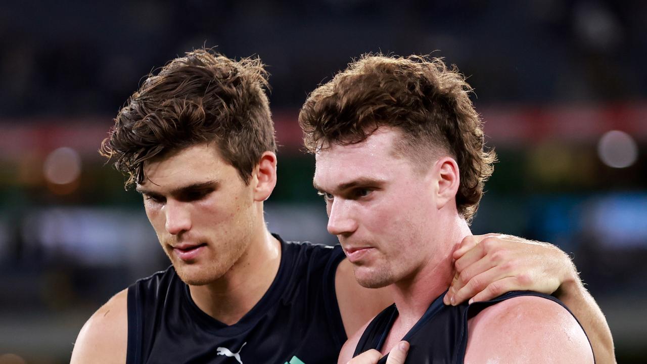 Lewis Young consoles Blake Acres after his crucial dropped mark in the dying seconds of Carlton’s draw with Richmond. Picture: Dylan Burns/AFL Photos