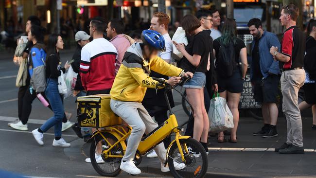 A rider looks at his phone. Picture: Tony Gough