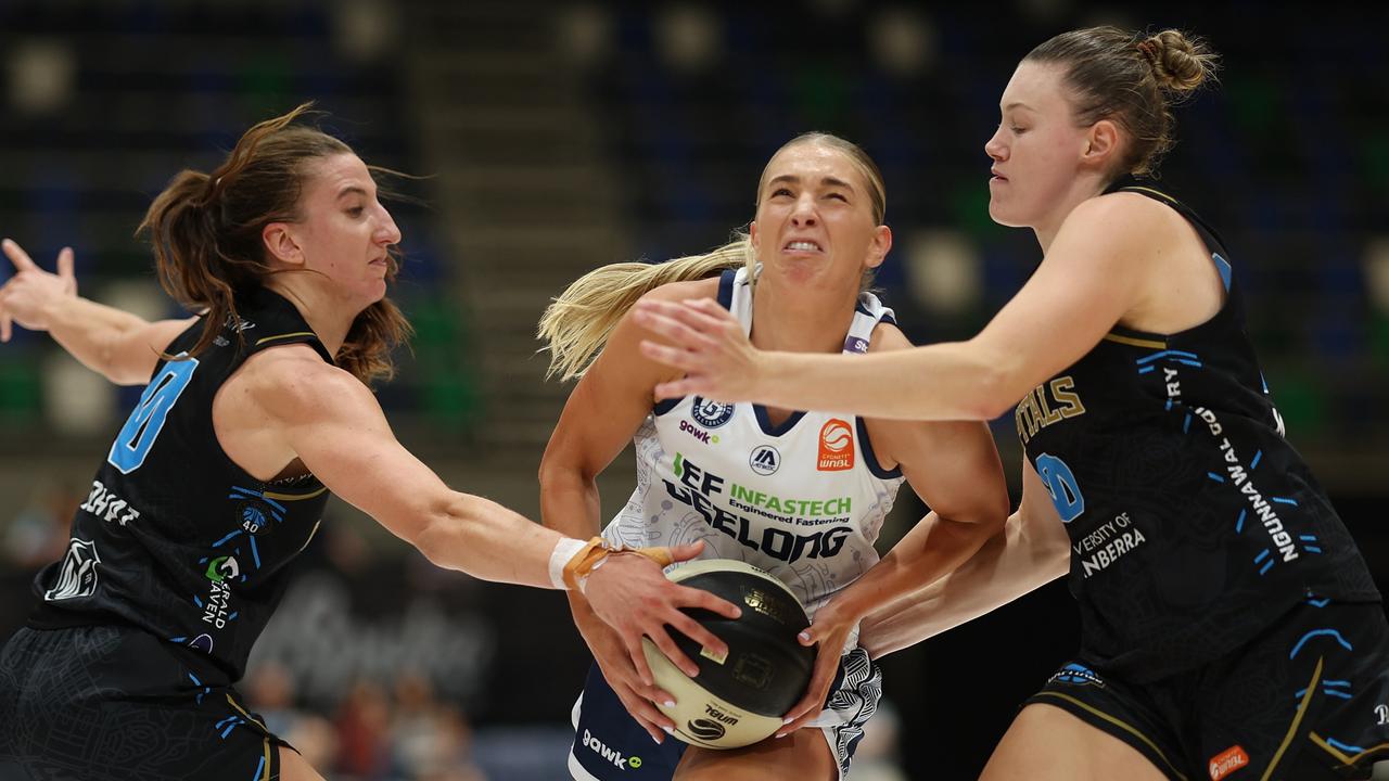 Geelong’s Jaz Shelley tries to drive past two Capitals opponents. Picture: Mark Metcalfe/Getty Images