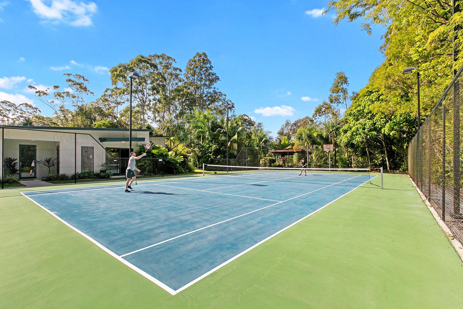 The full-sized flood-lit tennis court which triples its use for basketball or netball. Picture: Contributed