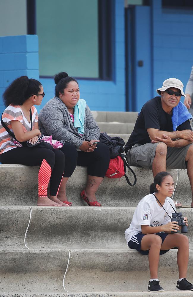 Tui’s mother, Sandra Tamano, second from left, waits for news at Maroubra beach with family and friends. Picture: Daniel Aarons