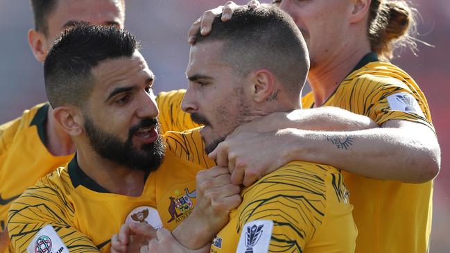 DUBAI, UNITED ARAB EMIRATES - JANUARY 11:  Jamie Maclaren of Australia celebrates with mates after scoring their team's first goal during the AFC Asian Cup Group B match between Palestine and Australia at Rashid Stadium on January 11, 2019 in Dubai, United Arab Emirates. (Photo by Francois Nel/Getty Images)