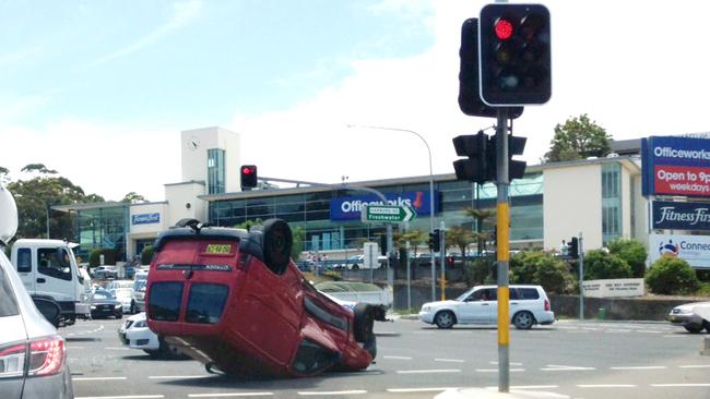 A van on its roof after a collision with a car at the “Officeworks” intersection of Warringah and Pittwater roads. Michael Regan, the Independent MP for Wakehurst, is pushing or the state and federal government to fund an upgrade to make the crossroads safer and less congested. Picture: Supplied