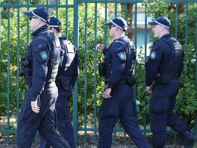 SUNDAY TELEGRAPH. APRIL 13, 2024.Pictured are Riot Squad Police conducting a line search outside Crawford Public School in Doonside today where a teenager was stabbed yesterday and then later died, in a gang related dispute along with another male. Picture: Tim Hunter.