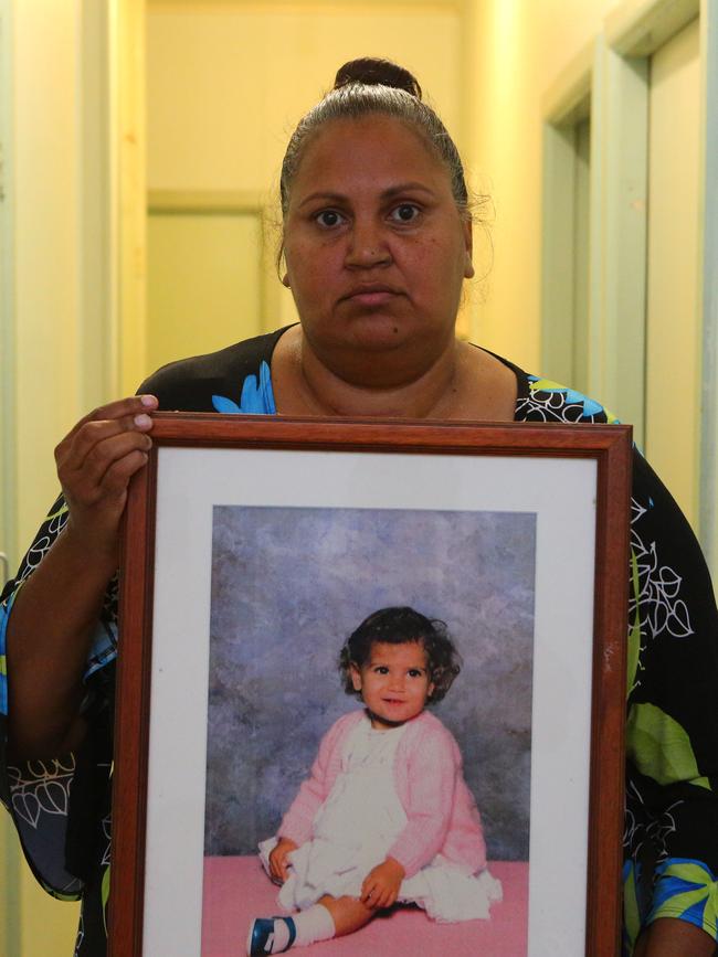 Michelle Jarrett, aunt of Evelyn Greenup, with a photograph of her niece.