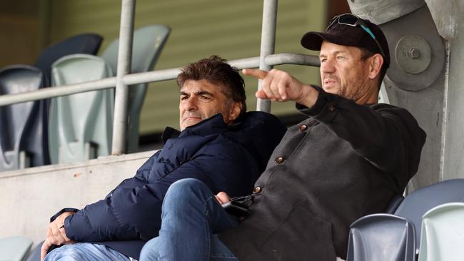 Essendon list manager Adrian Dodoro and Mark Harvey watch the AFL Academy v Geelong match last month. Picture: Michael Klein