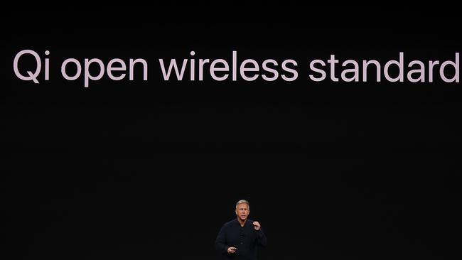 Apple senior vice president of worldwide marketing Phil Schiller talks about wireless charging. Picture: AFP