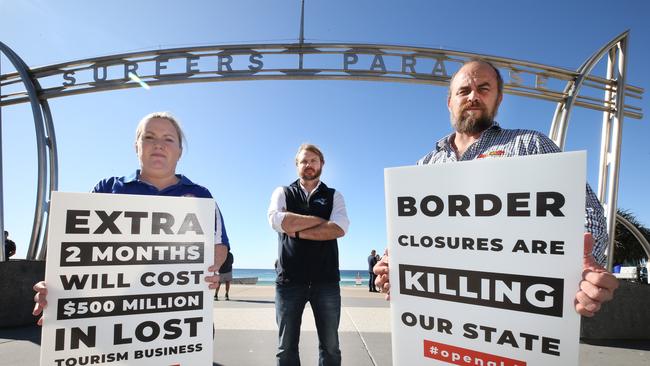 Sarah Colgate from Aquaduck, Anthony Ardern from Whales in Paradise and Greg Daven from Hot Air Balloon Cairns and Gold Coast protesting in Surfers Paradise. Picture: Glenn Hampson.