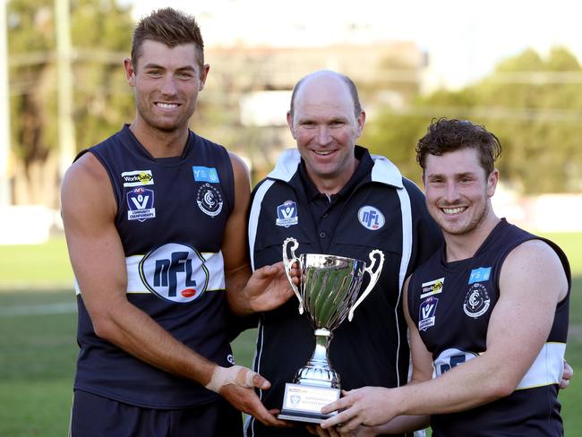 Garry Ramsay with captains Matt Dennis and Jesse Donaldson after leading the NFL representative team to a win.  Picture: Mark Wilson