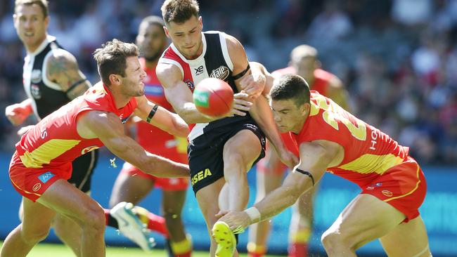 Jack Sinclair of the Saints gets a kick away under pressure. Picture: Michael Klein.