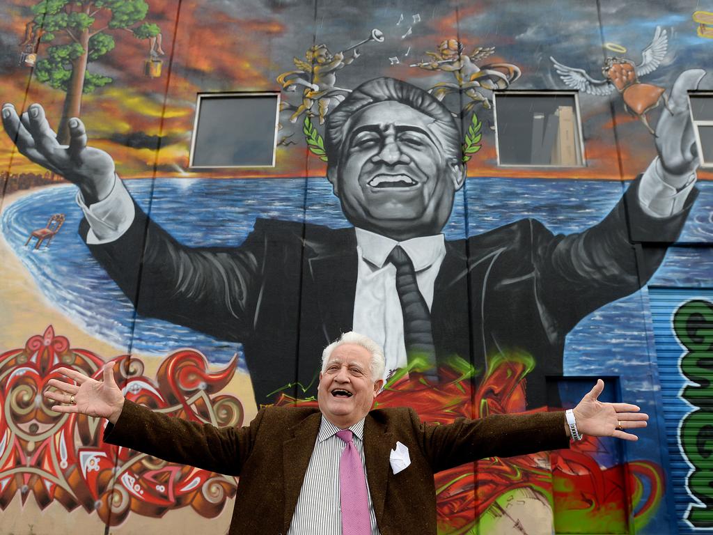 Franco Cozzo with art work of himself on the side of his building in Footscray. Picture: David Smith