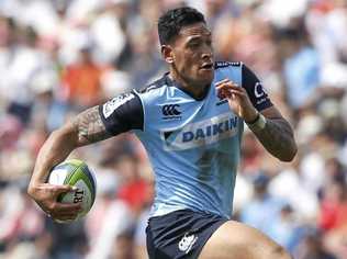 FULL FLIGHT: Israel Folau of the Waratahs takes the ball forward against the Sunwolves in Tokyo. Picture: YUYA SHINO