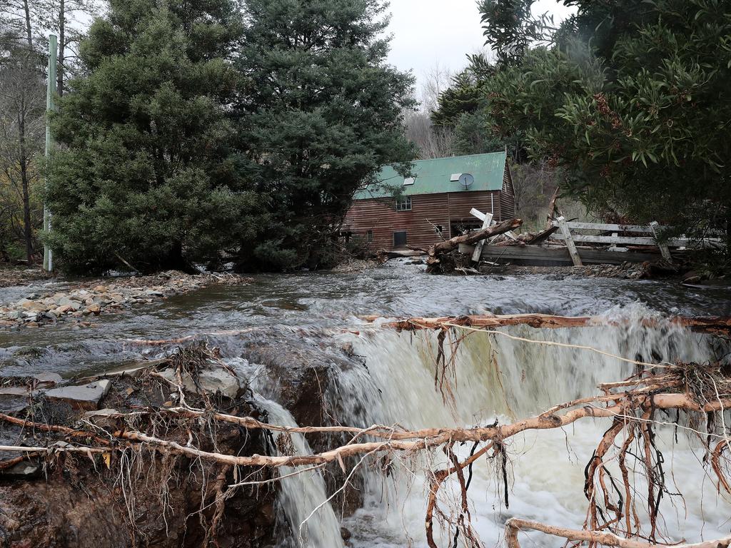 Flood water rushed past an old structure on Glen Dhu Road in Molesworth. Picture: LUKE BOWDEN