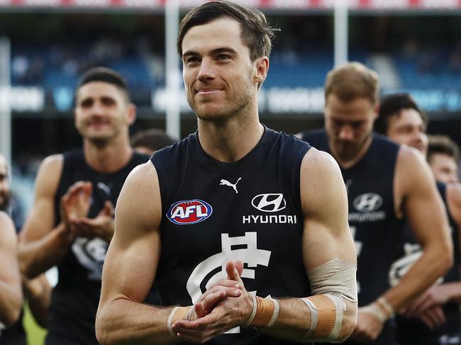 MELBOURNE, AUSTRALIA - MAY 22: Lachie Plowman of the Blues leads the team off the ground after a win during the 2021 AFL Round 10 match between the Carlton Blues and the Hawthorn Hawks at the Melbourne Cricket Ground on May 22, 2021 in Melbourne, Australia. (Photo by Dylan Burns/AFL Photos via Getty Images)