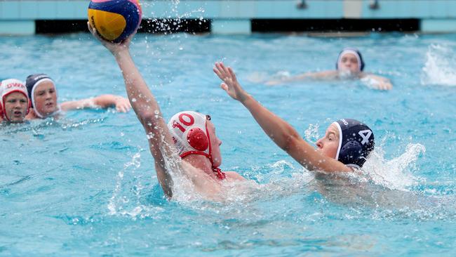 Connor Bradshaw and Tom Liddell in the thick of the action during the under-14 men’s clash between Gosford and Wyong at Gosford Pool on Saturday. Picture: Sue Graham