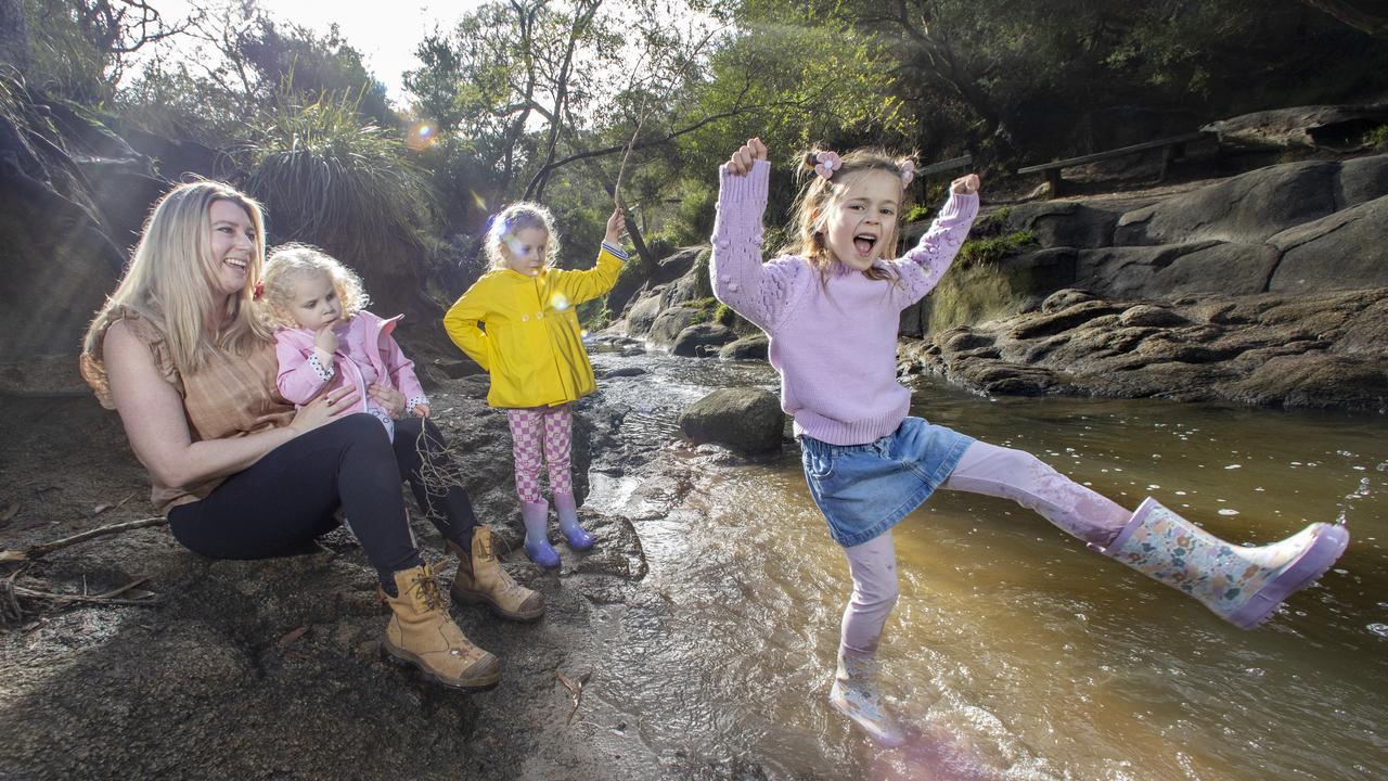 Deakin University researchers found preschool-aged kids who played outdoors with sticks, trees and sand were more likely to perform better in STEM subjects once they started school. Bush Kindergarten owner Natalie Cross runs a weekly outdoor program and is pictured with Frankie, 3, Loa, 5, and Evie, 5. Picture: Alex Coppel