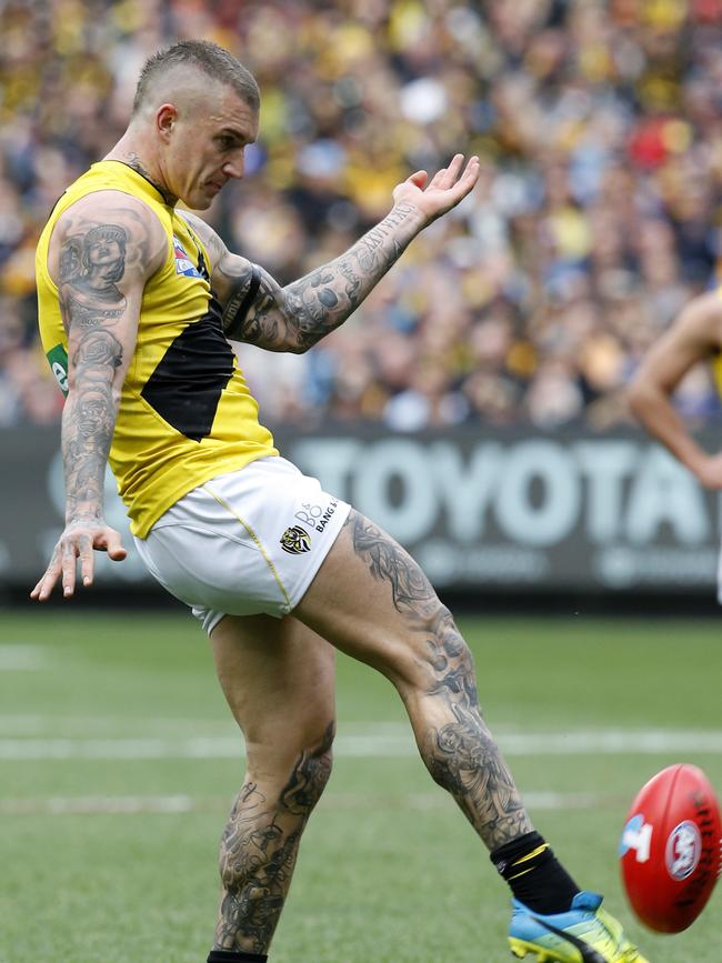 Richmond's Dustin Martin kicks a goal in the second quarter. Picture: David Caird