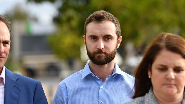 Dreamworld ride operator Timothy Williams (centre) is seen leaving the inquest into the Dreamworld disaster at the Southport Courthouse on the Gold Coast, Thursday, June 21, 2018. Cindy Low, Kate Goodchild, her brother Luke Dorsett and his partner Roozi Araghi all died when Dreamworld's Thunder River Rapids ride malfunctioned in October 2016. (AAP Image/Darren England)