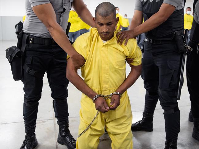 An alleged member of the Venezuelan criminal organisation Tren de Aragua upon arrival at the Terrorism Confinement Centre in the city of Tecoluca, El Salvador. Picture: AFP