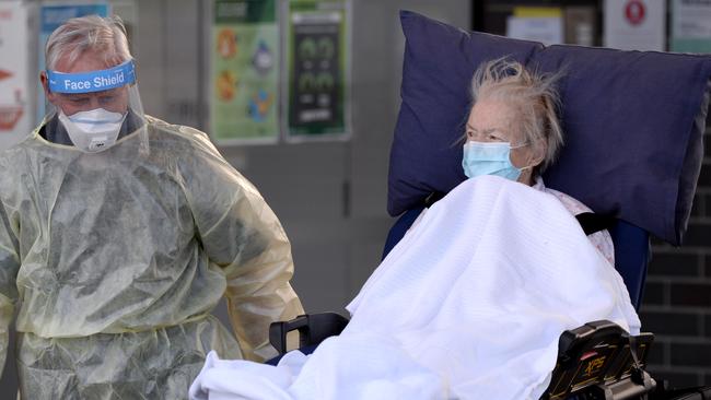 A resident is evacuated from an Epping aged care home. Picture: Andrew Henshaw