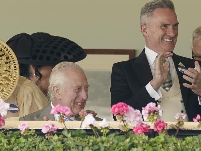 ASCOT, ENGLAND - JUNE 18: Neil Wilson, Chairman of VRC (2R) watching from the Royal Box with King Charles III delights at an Australian horse Asfoora winning The King Charles III Stakes during day one of Royal Ascot 2024 at Ascot Racecourse on June 18, 2024 in Ascot, England. (Photo by Alan Crowhurst/Getty Images for Ascot Racecourse)