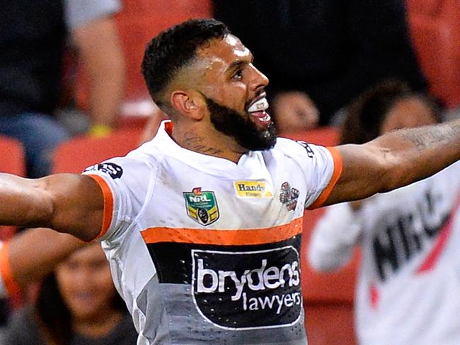 BRISBANE, AUSTRALIA - MAY 27: Joshua Addo-Carr of the Tigers celebrates scoring a try during the round 12 NRL match between the Brisbane Broncos and the Wests Tigers at Suncorp Stadium on May 27, 2016 in Brisbane, Australia. (Photo by Bradley Kanaris/Getty Images)