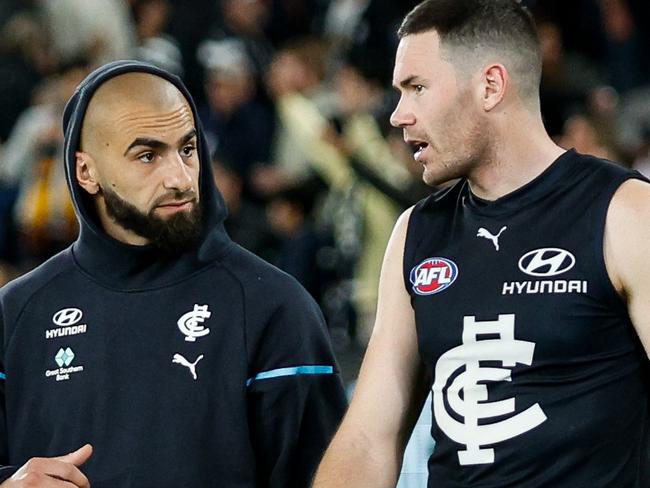 MELBOURNE, AUSTRALIA - APRIL 13: Adam Saad and Mitch McGovern of the Blues are seen during the 2024 AFL Round 05 match between the Carlton Blues and the Adelaide Crows at Marvel Stadium on April 13, 2024 in Melbourne, Australia. (Photo by Dylan Burns/AFL Photos via Getty Images)