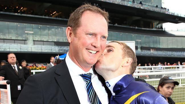 Michael Hawkes gets a kiss from Tommy Berry after Chautauqua’s win in the TJ Smith Stakes. Picture: Mark Evans