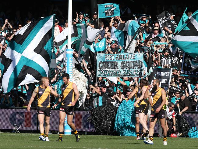 AFL Elimination Final - Port Adelaide v Richmond at Adelaide Oval. Port cheer squad erupt as Richmond players walk away shell shocked.  Photo Sarah Reed.