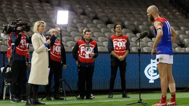 Max Gawn does a TV interview, missing out on the Demons song in his first game as captain.