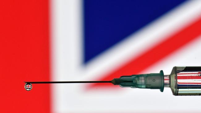 A drop of the AstraZeneca vaccine with a flag of the United Kingdom reflected in it. Picture: Justin Tallis/AFP