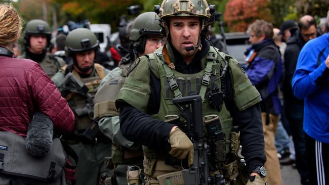 SWAT members leave the Tree of Life Synagogue yesterday. Picture: Getty Images