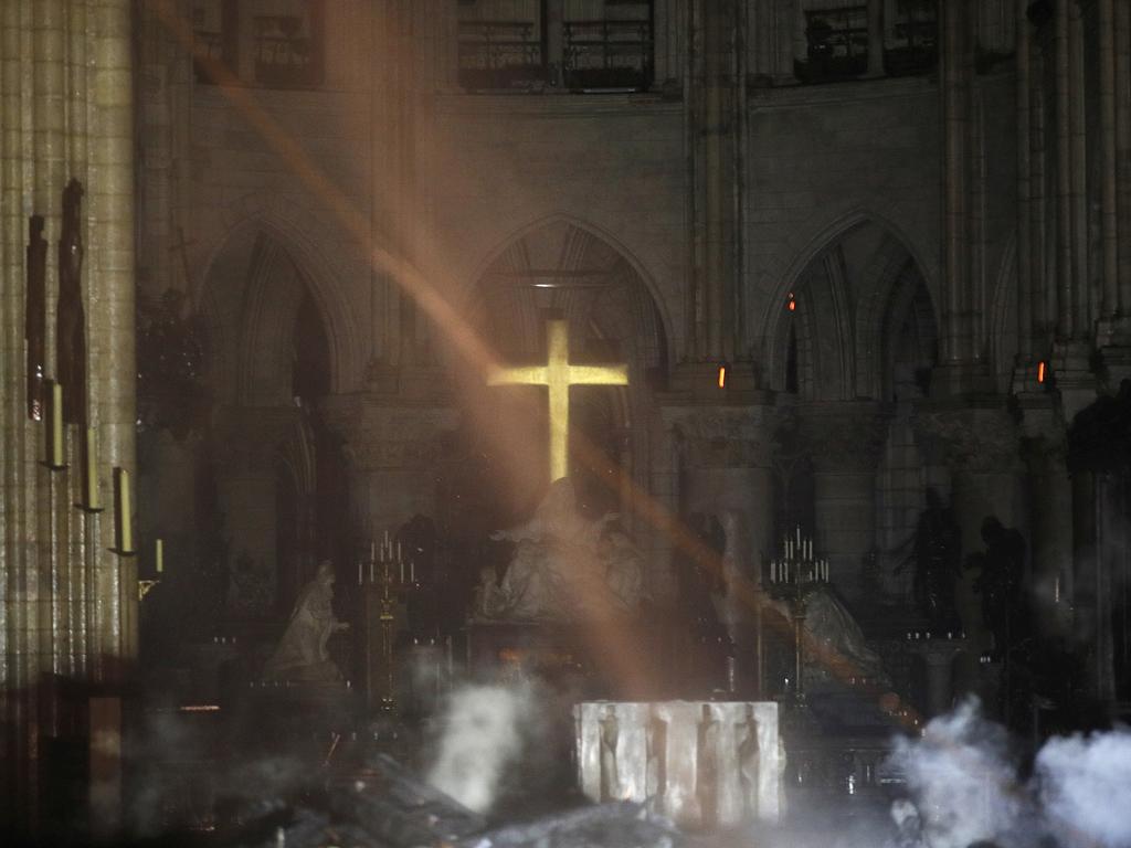 Rubble smoulders inside the Notre Dame Cathedral. Picture: Philippe Wojazer / Pool / AP