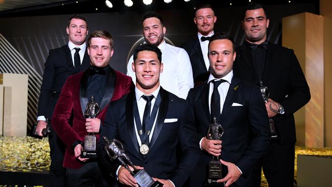 2018 Dally M Medal winner Roger Tuivasa-Sheck (centre) poses for a photograph with Dally M team of the Year members (from left) Josh Jackson, Cameron Munster, Jazz Tevaga, Damien Cook, Luke Brooks and Andrew Fifita. Picture: AAP