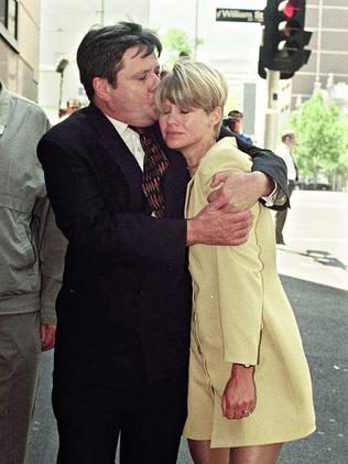 Watson-Munro hugs his wife Carla outside of Melbourne magistrates court where he appeared on drug charges. Picture: Craig Hughes