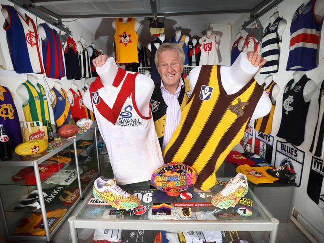 Footy jumper enthusiast Wayne Jordan has a prIvate collection of footy jumpers but is thinking of opening up his collection to the public ahead of the finals, for a gold coin donation. Wayne wearing a Richmond Tigers lace-up jumper from 1981 plus holding a South Melbourne Swans 1977 and Hawthorn 1978 jumpers from his collection.                       Picture: David Caird