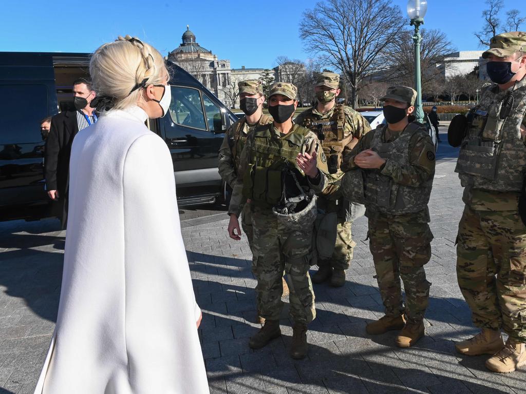 Lady Gaga, greets National Guard soldiers as she leaves the US Capitol building. Picture: AFP