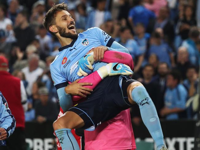 Vukovic hoists Sydney’s hero. Picture: Brett Costello