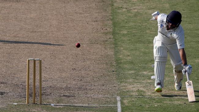 Ryan Pearson narrowly avoids being run out early in his innings.