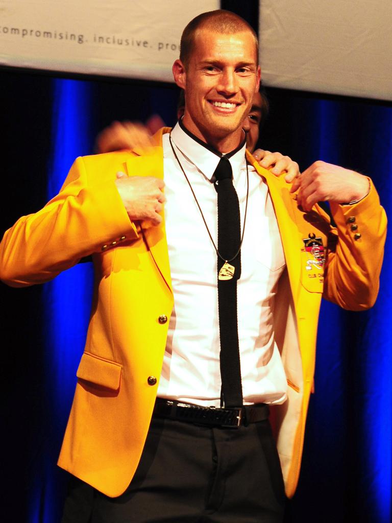 2011 - Scott Thompson slips on the gold jacket as Adelaide Crows club champion.