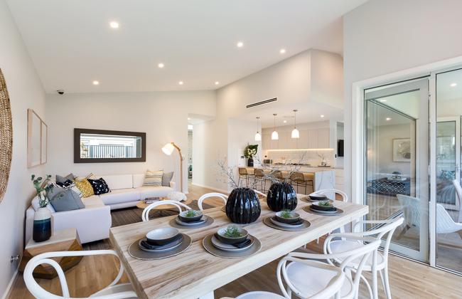 The galley kitchen is positioned for ease of access, just beyond the TV room in the centre of the house.