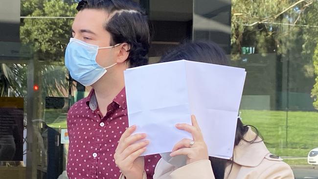 Jessica Suat Yun Lee supported by her husband Sebastian Penedo hid her face from the media when leaving Sutherland Local Court. Picture: Ashleigh Tullis