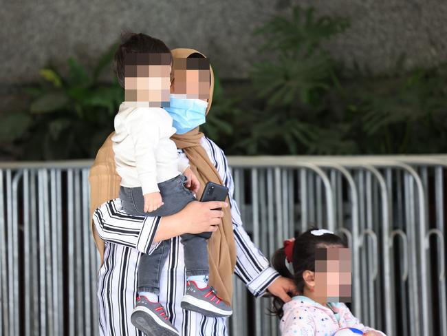 *** WARNING: FACES CANNOT BE IDENTIFIED - FACES NEED TO BE PIXILATED BEFORE USING *** ADELAIDE, AUSTRALIA - NewsWire Photos SEPTEMBER 9, 2021:  Evacuees from Afghanistan depart the Hotel Grand Chancellor in Adelaide after completing their fourteen day quarantine. Picture: NCA NewsWire / David Mariuz