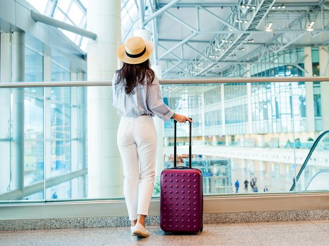 ESCAPE: When holidays go wrong, Paul Ewart - Airline passenger in an airport lounge waiting for flight aircraft. Caucasian woman with smartphone in the waiting room  Picture: Istock