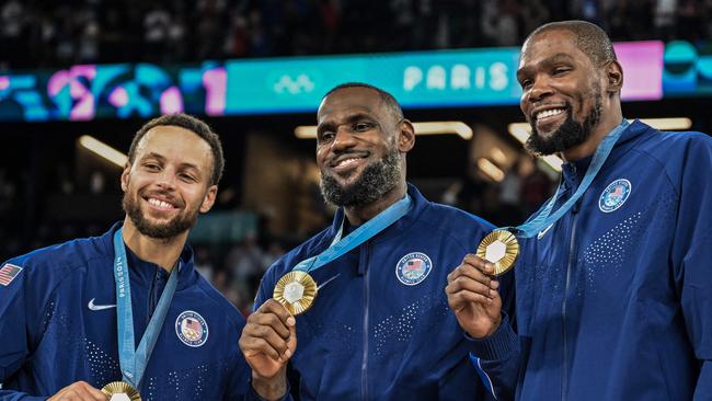 Stephen Curry (Left) helped the US clinch an Olympic god medal against France on Saturday. Curry pictured with Team USA teammates LeBron James (C) and Kevin Durant (R). Picture: AFP