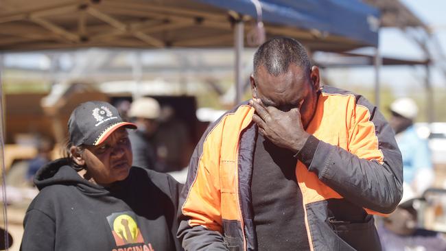 Dwayne Ross is comforted by Barbara Shaw during the 90th anniversary commemoration of the Coniston Massacre at Yurrkuru on Friday, August 24, 2018. Picture: Keri Megelus