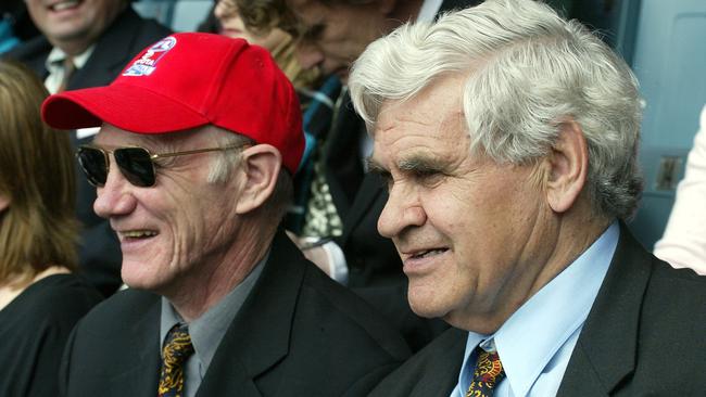 Kevin Bartlett and Polly Farmer sit together at the 2004 Grand Final.