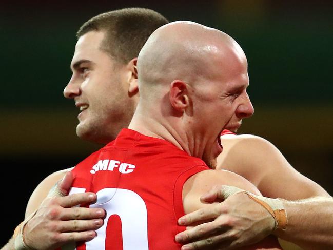 SYDNEY, AUSTRALIA - JUNE 29: Tom Papley of the Swans celebrates kicking a goal with team mate Zak Jones of the Swans during the round 15 AFL match between the Sydney Swans and the Gold Coast Suns at Sydney Cricket Ground on June 29, 2019 in Sydney, Australia. (Photo by Cameron Spencer/AFL Photos via Getty Images)