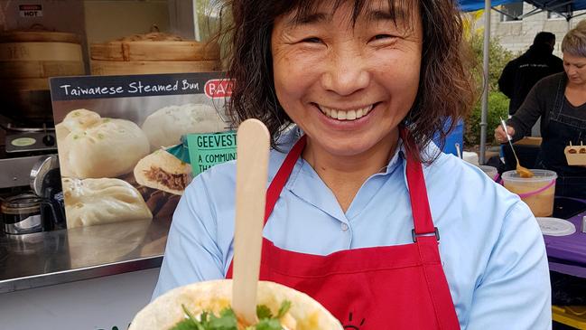 Cassandra Rolph of Deep End Farm samples fare from Pocket Curries at the Geeveston Feast. Picture: ELAINE REEVES